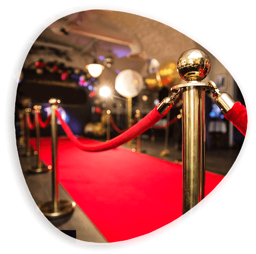 A red carpet with a rope and poles