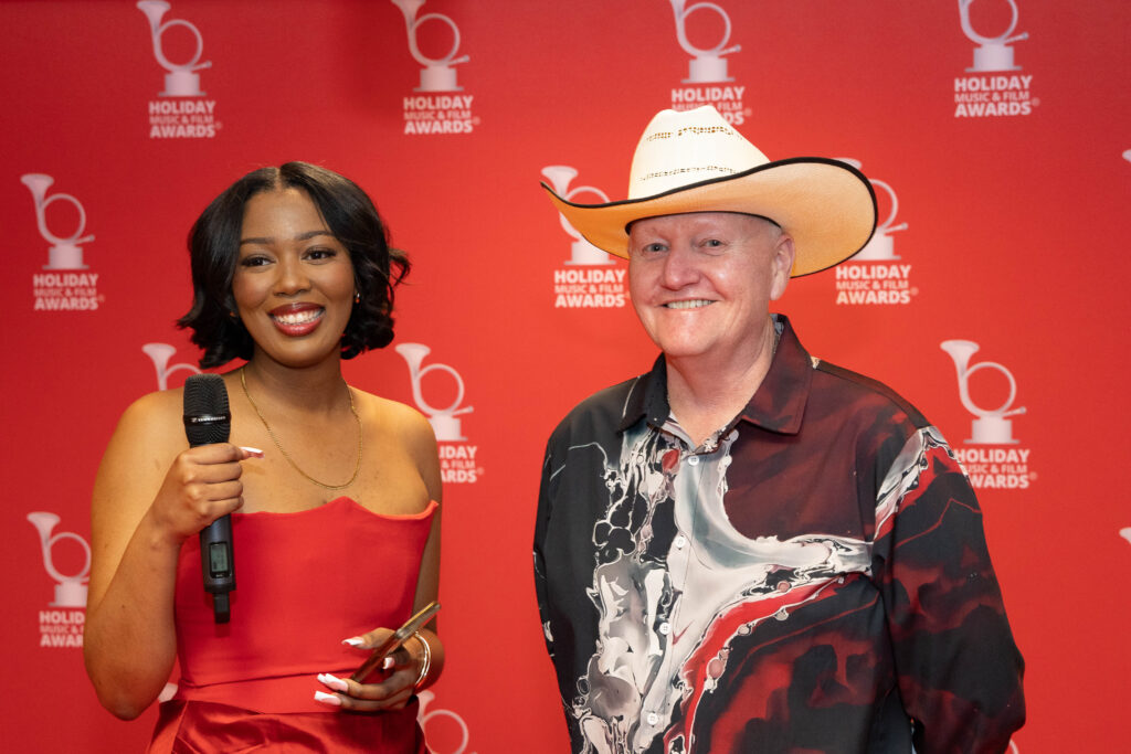 A woman and man posing for the camera.